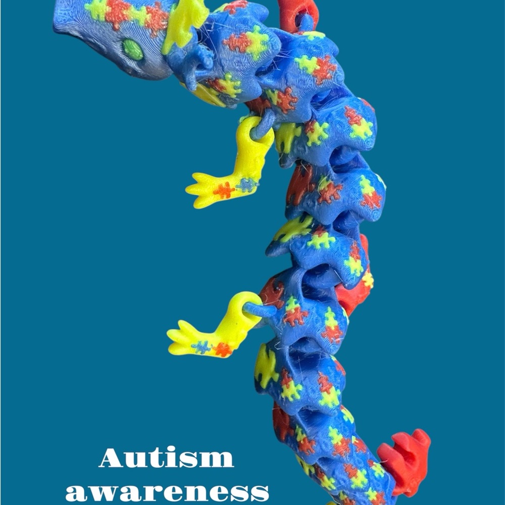 Vibrant autism awareness fidget dragon.
